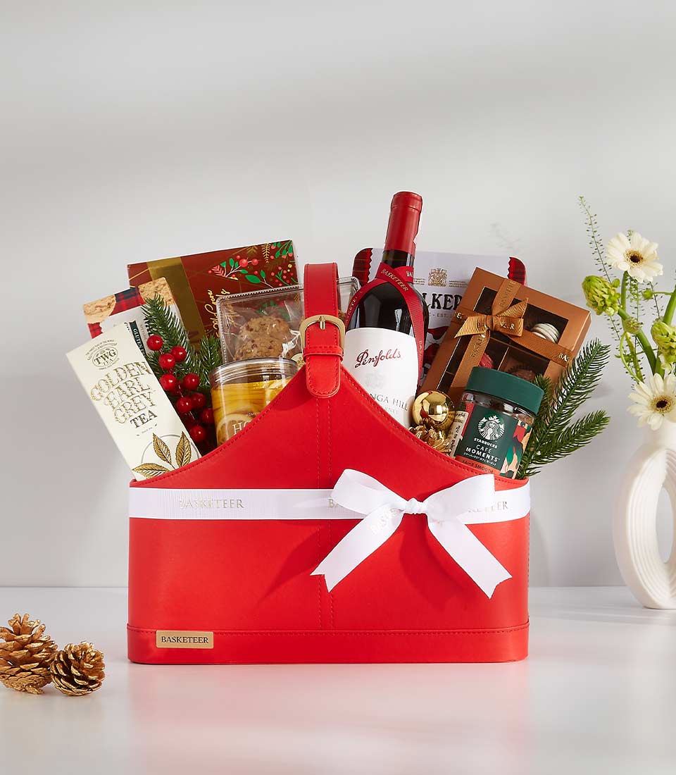 This elegant gift basket is filled with a variety of gourmet treats and beverages, including a fine red wine from Penfolds,