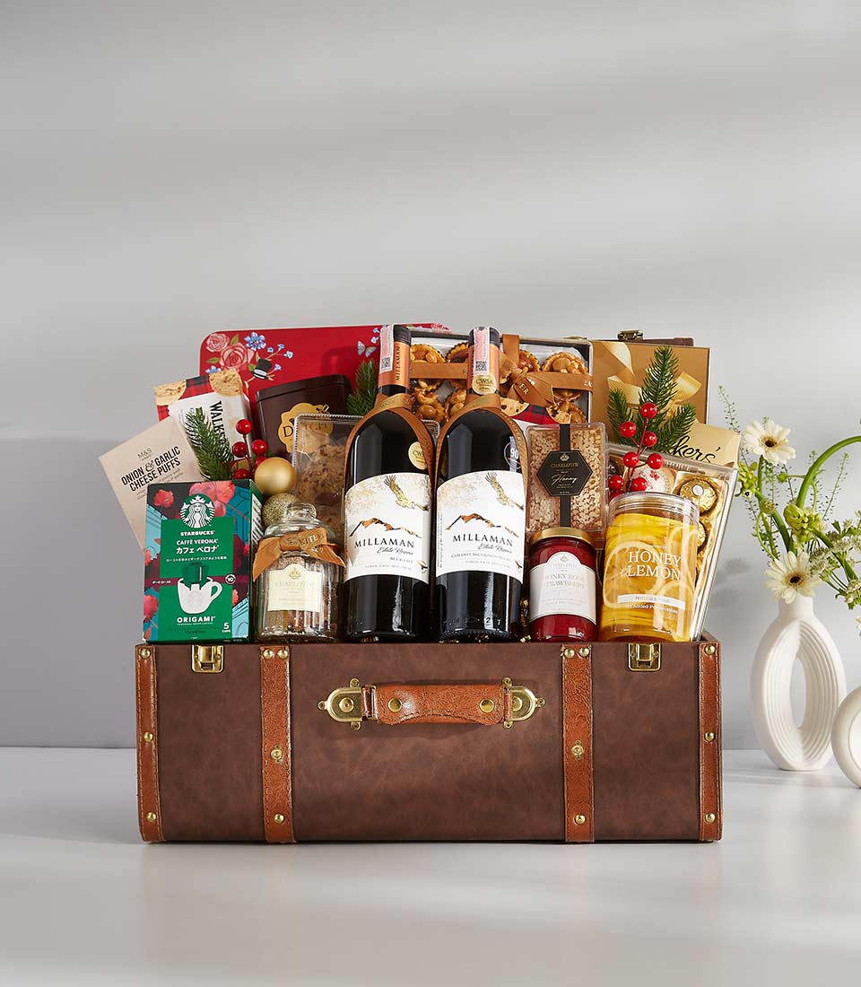 This elegant gift basket is filled with a variety of gourmet treats and personal items, including coffee, fine wines, and various snacks.