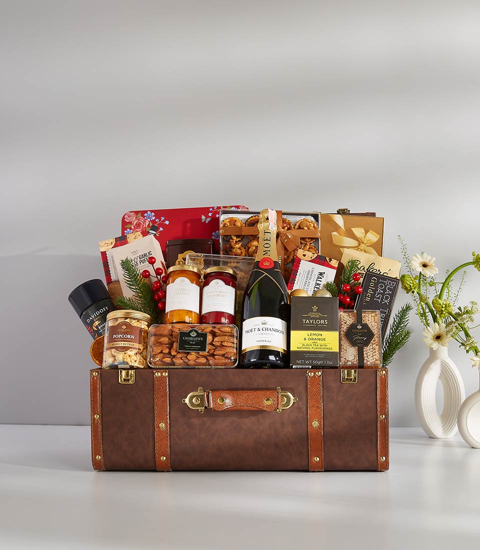This elegant gift basket is filled with a variety of gourmet treats and beverages, including Moët & Chandon champagne