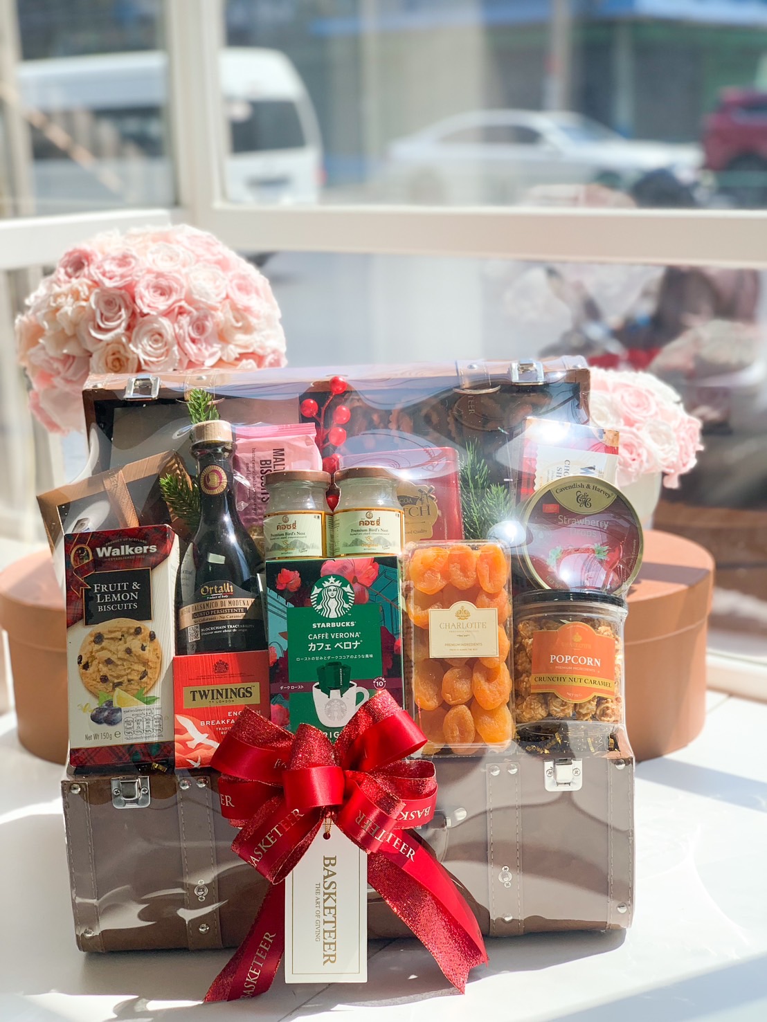 Surprise your loved ones with a luxurious gourmet hamper! Featuring premium coffee, tea, biscuits, dried fruits, and popcorn, elegantly arranged in a stylish trunk. Ideal for corporate gifts, celebrations & special occasions.
