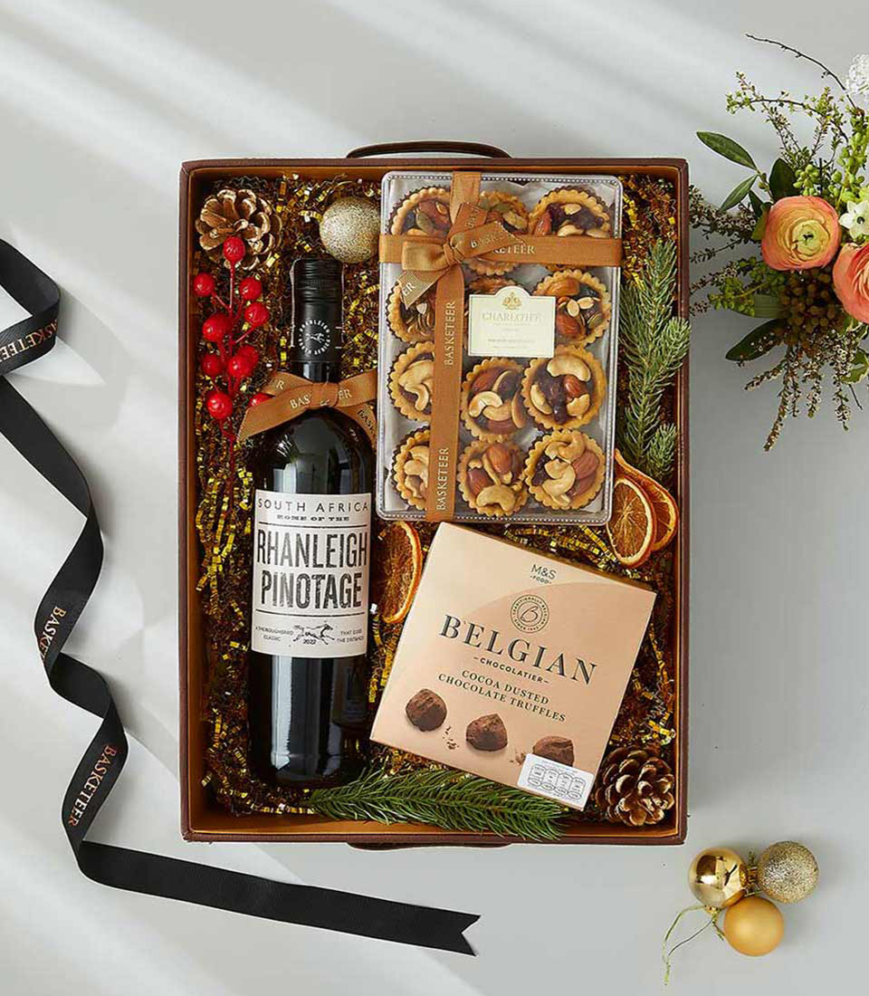 gift box filled with a bottle of South African Pinotage, Belgian chocolate truffles, and gourmet biscuits