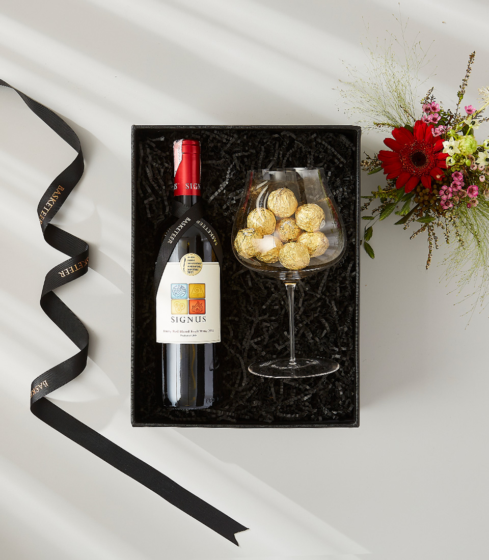 Gift box containing a bottle of red wine labeled 