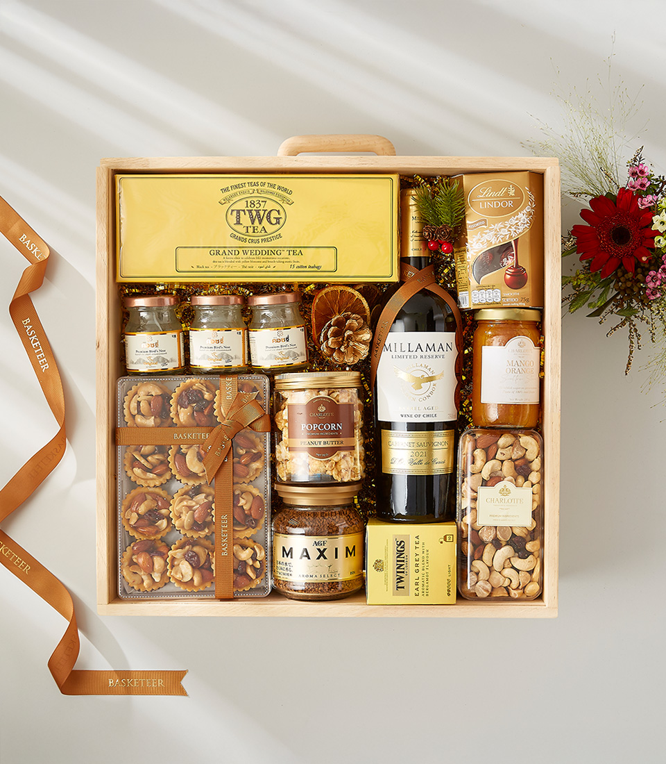 Luxury gift hamper containing a bottle of champagne, gourmet snacks, and bird's nest