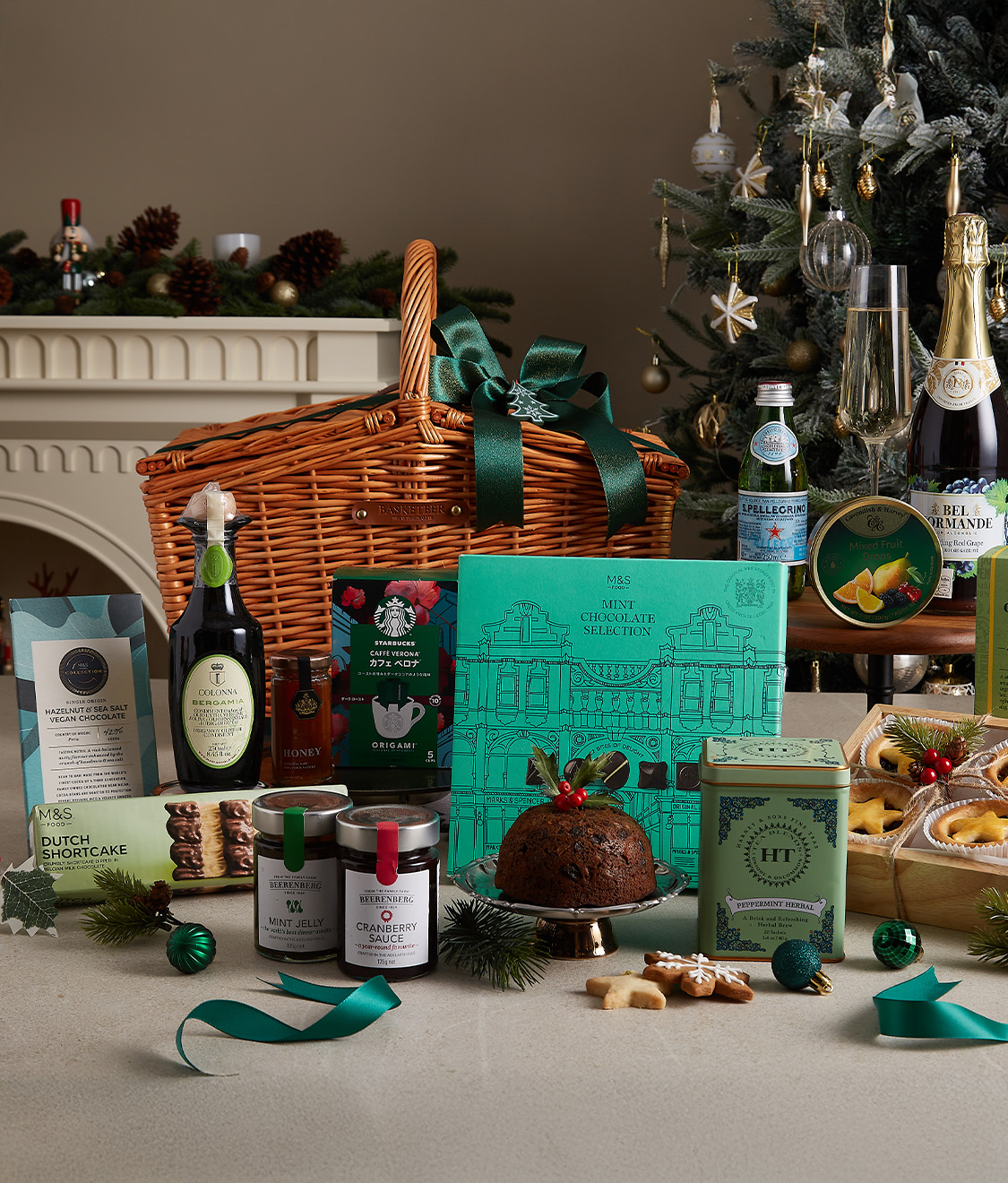 A beautifully crafted wooden display featuring snow-dusted cottages, evergreen sprigs, pinecones, red berries, and cotton accents, presented in a wooden box with a red ribbon.