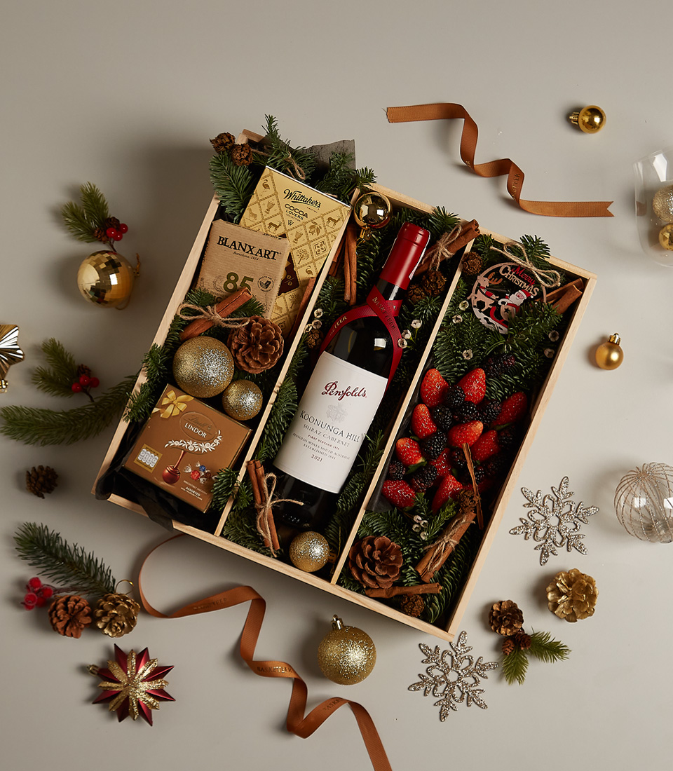 Festive gourmet gift tray featuring fresh berries, artisanal chocolates, and a luxurious design for special celebrations.