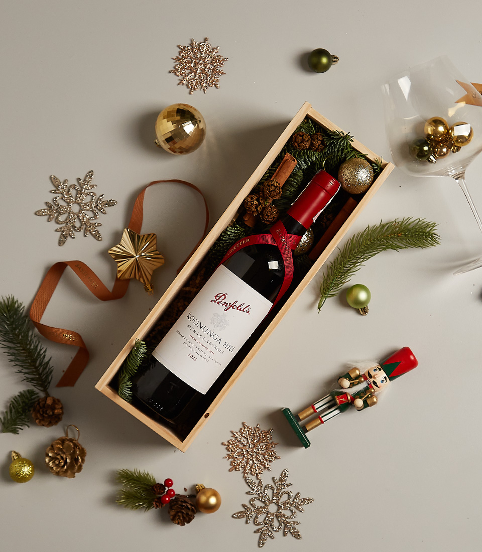 Luxury holiday gift box with premium selection, festive ornaments, and elegant packaging.