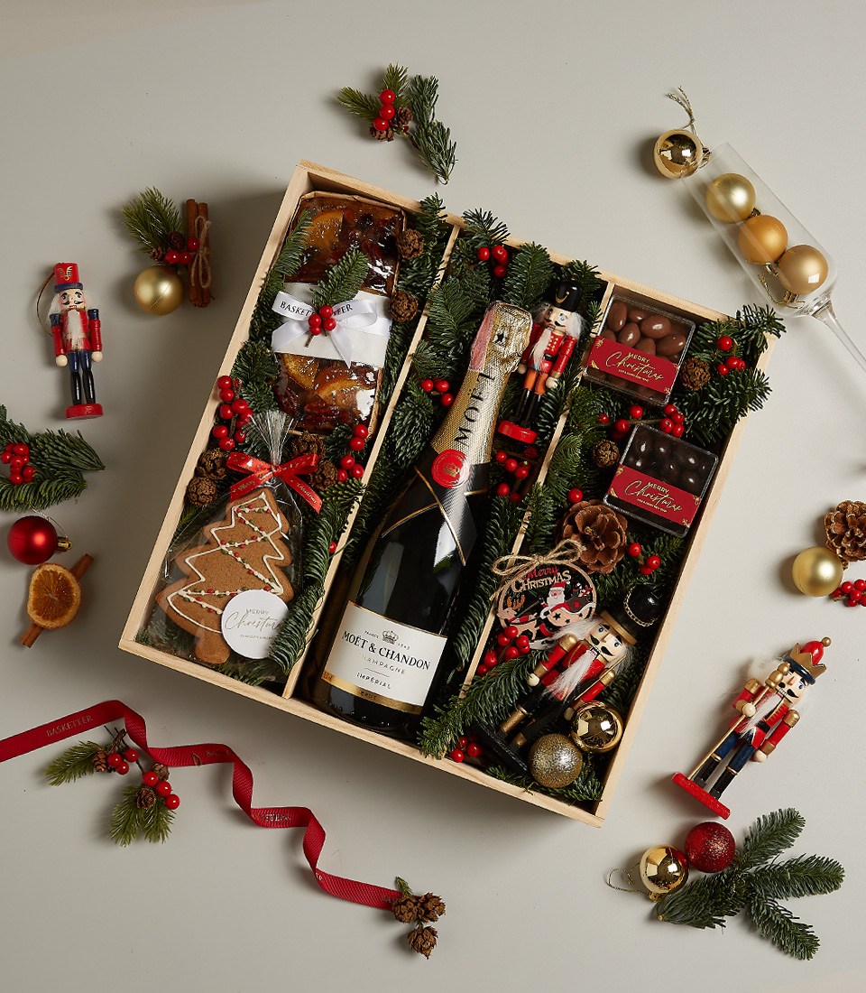 Elegant holiday gift box with chocolates, festive treats, and seasonal decorations for a memorable celebration.