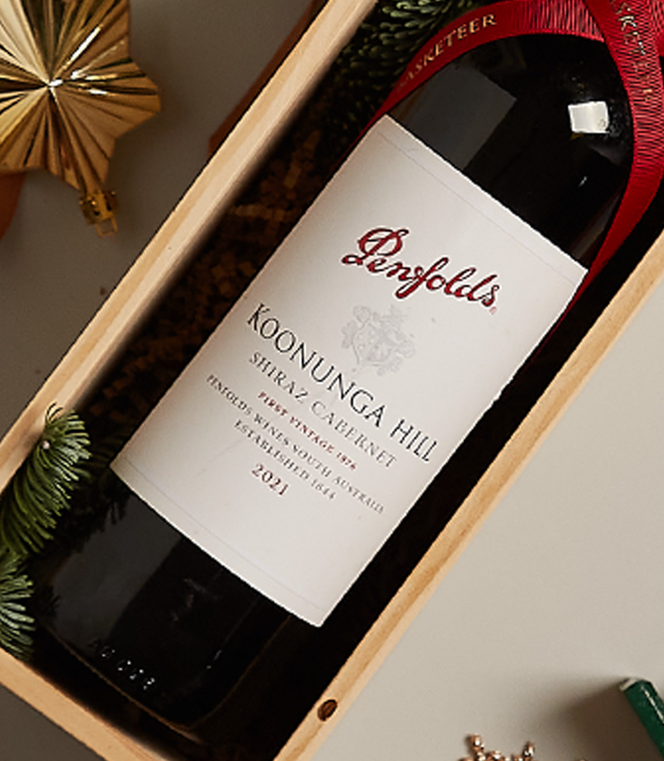 Luxury holiday gift box with premium selection, festive ornaments, and elegant packaging.