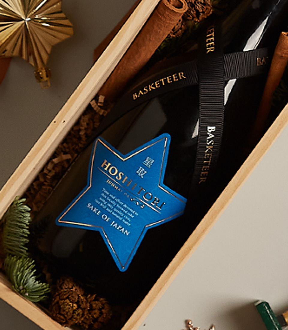 Elegant holiday gift box with premium items, festive decor, and a charming seasonal design.