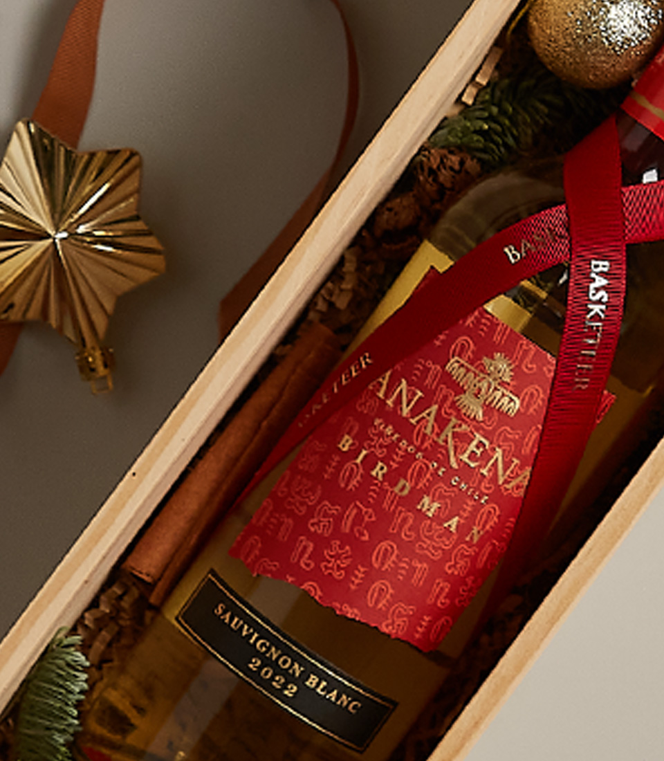Charming festive gift box with vibrant accents and a carefully curated selection for holiday gifting.