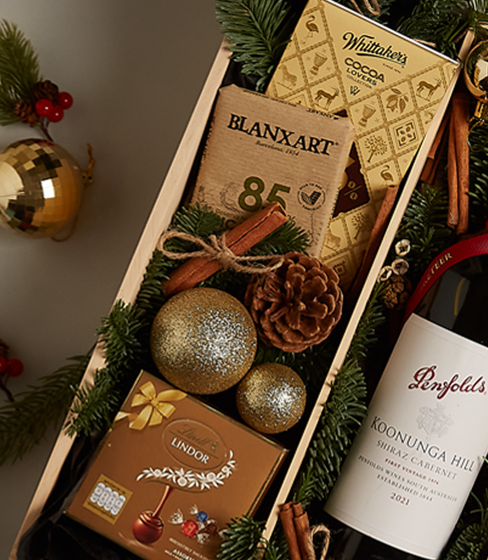 Festive gourmet gift tray featuring fresh berries, artisanal chocolates, and a luxurious design for special celebrations.