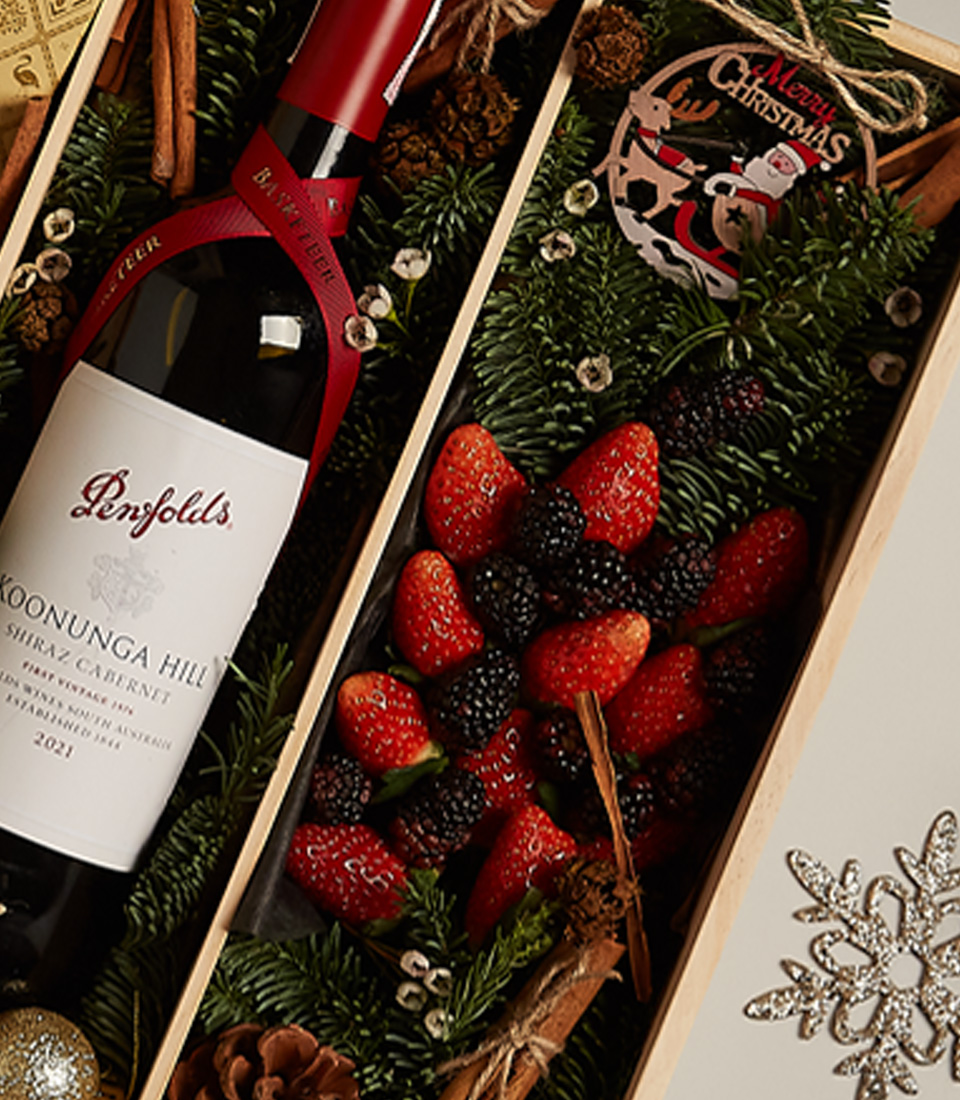 Festive gourmet gift tray featuring fresh berries, artisanal chocolates, and a luxurious design for special celebrations.