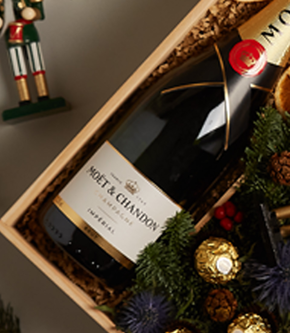 Holiday gift box with nutcrackers, festive decorations, and premium treats for a luxurious celebration.