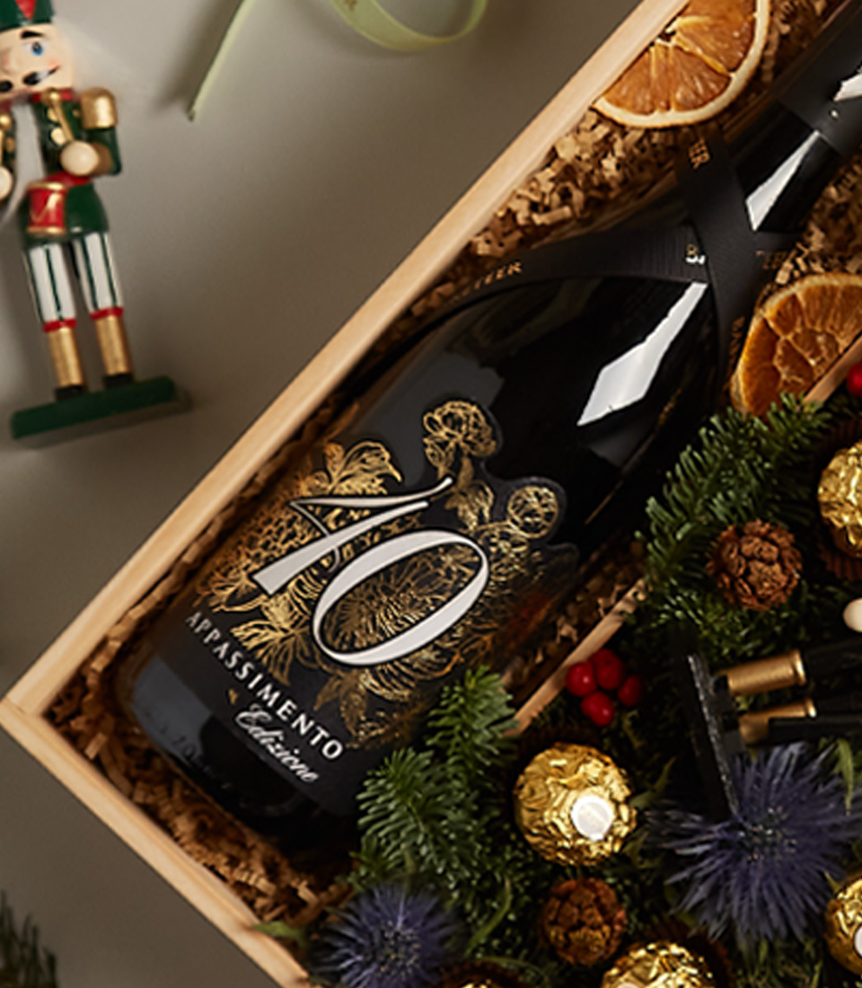 Luxurious holiday gift box with nutcrackers, golden accents, and premium treats for the festive season.