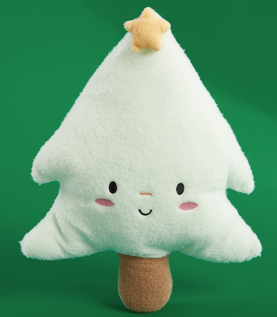 Cute plush white Christmas tree doll with a golden star topper and rosy cheeks on a green background.
