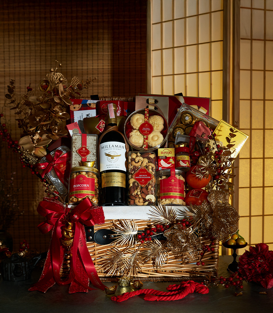 Premium Prosperity Celebration Basket with fresh oranges, festive snacks, and luxurious gold accents for Chinese New Year.