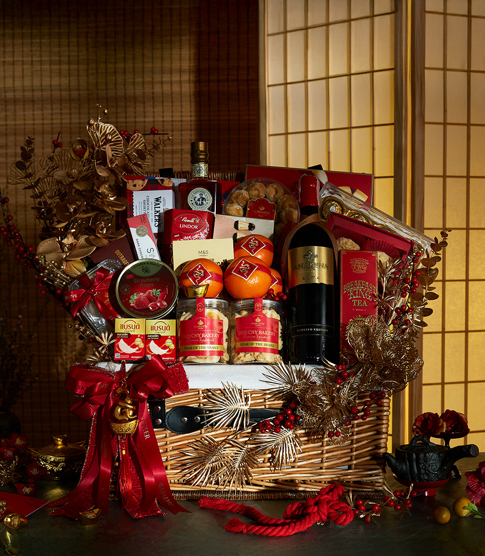 Golden Prosperity Chinese New Year gift hamper with premium wine, gourmet treats, festive fruits, and elegant decorations.