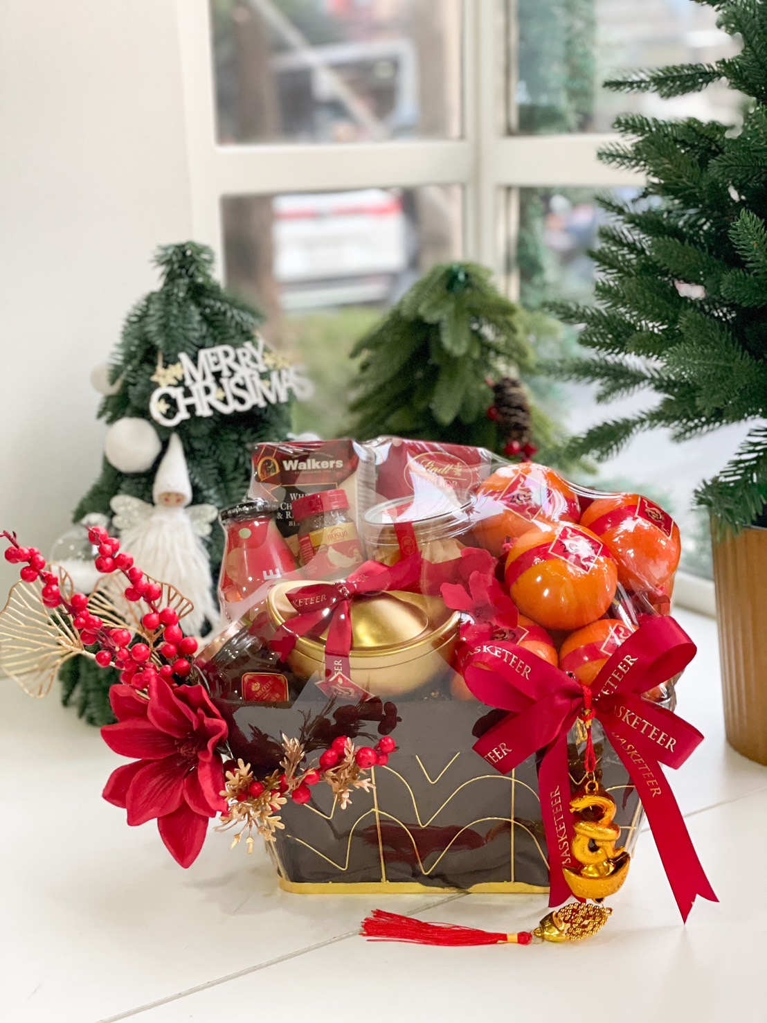 Golden Harmony Chinese New Year Gift Basket with oranges, golden accents, and festive treats.