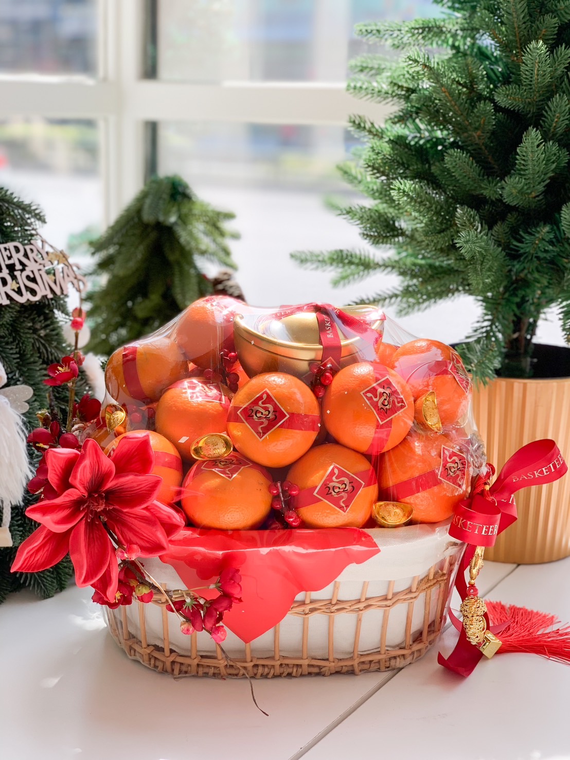 Golden Fortune Basket with Chinese New Year oranges and golden ingot for festive celebrations.