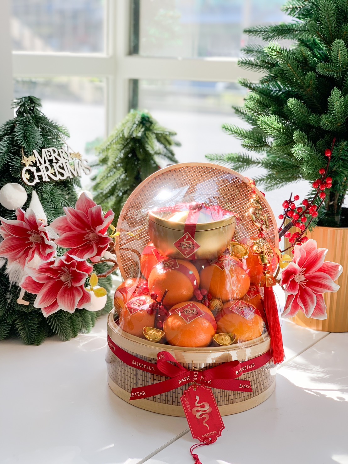 Golden Prosperity Basket with fresh oranges, golden ingot, and festive decorations for Chinese New Year.