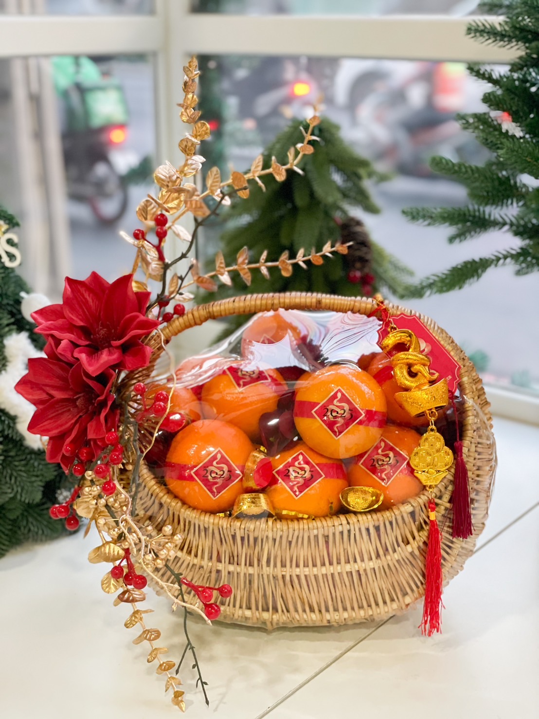 Prosperity Basket with Chinese New Year oranges and festive decorations.