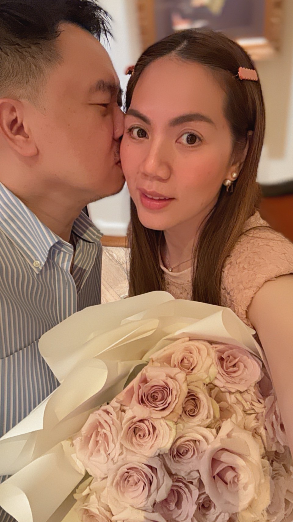 A luxurious bouquet of soft pink roses, elegantly wrapped in white paper, perfect for romantic gestures, anniversaries, or Valentine's Day.