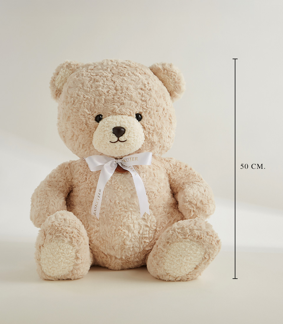 Large beige plush teddy bear with a white ribbon, soft and huggable, perfect for gifts, snuggles, and special occasions.
