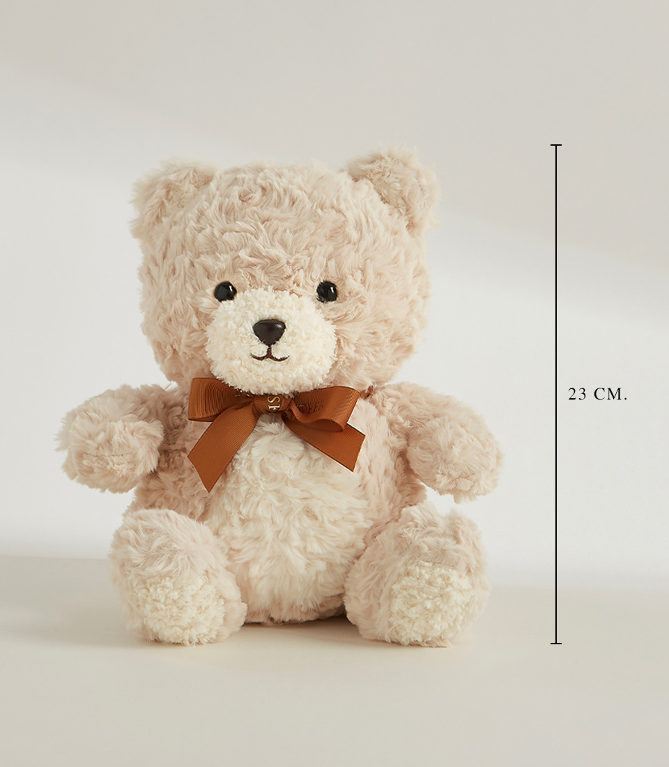 Soft beige teddy bear with a brown bow, featuring a plush and cuddly design, perfect for gifting and cozy snuggles.