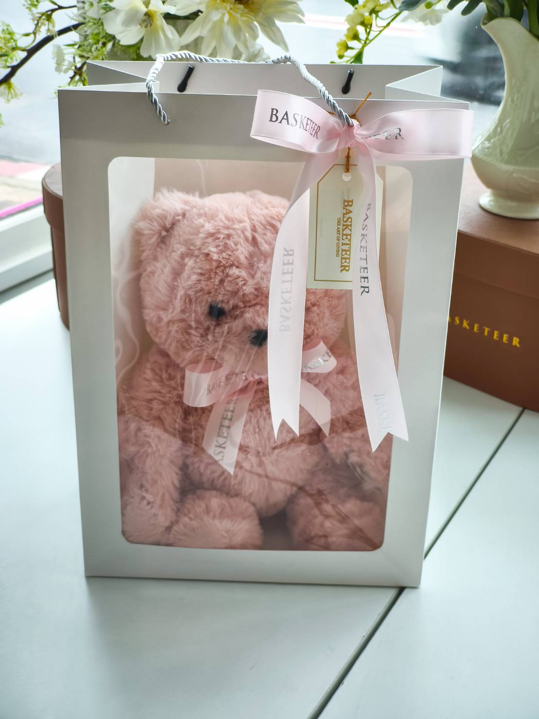 Pink teddy bear in luxury gift box with satin ribbon, perfect for birthday, anniversary, or Valentine’s Day gift