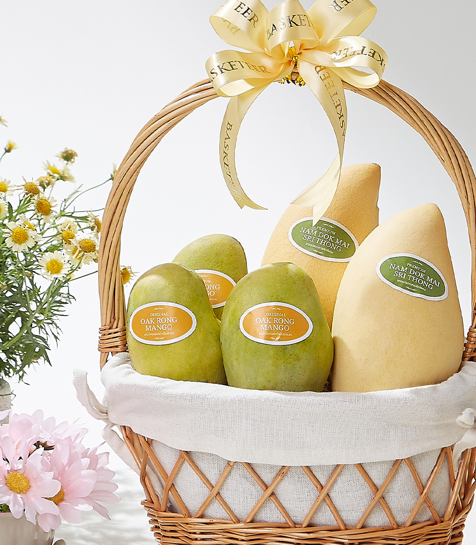 A premium wooden crate filled with handpicked golden Okrong mangoes, elegantly adorned with a satin ribbon, showcasing their rich aroma, creamy texture, and naturally sweet taste—a true indulgence for mango lovers.