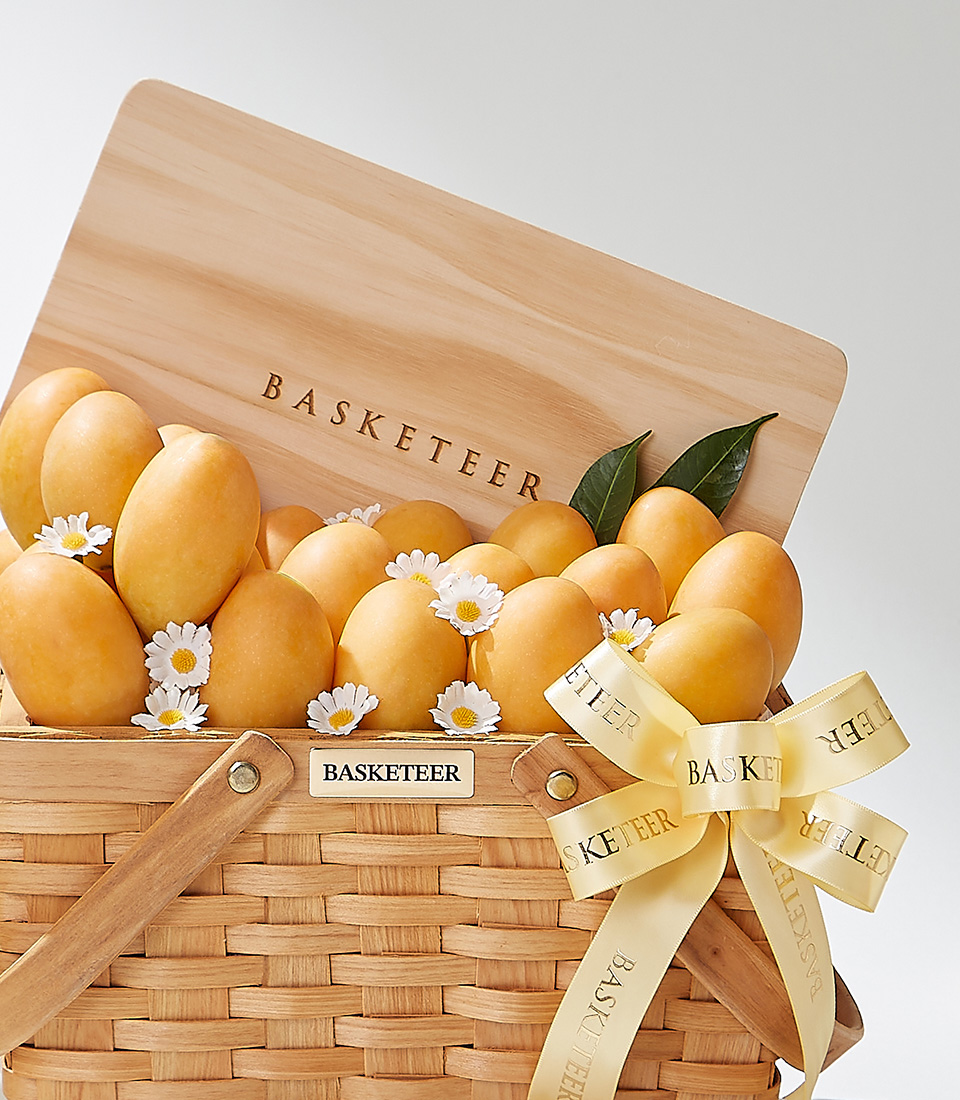 A wicker basket filled with premium Mayongchids of the Toon Klaow variety from Nakhon Nayok beautifully decorated with white daisies and a yellow ribbon