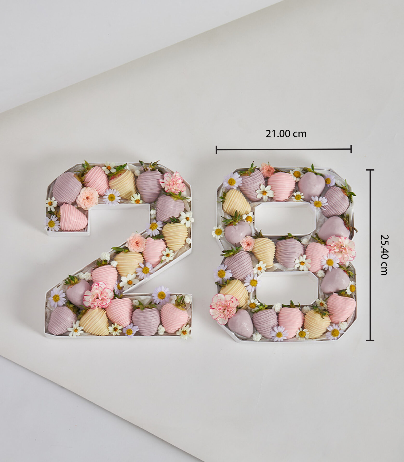 Pastel number 28 gift box with chocolate-dipped strawberries and flowers