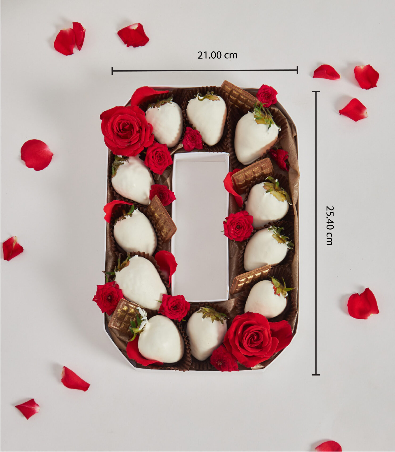Number 0 box filled with white chocolate-covered strawberries and red roses for romantic gifting