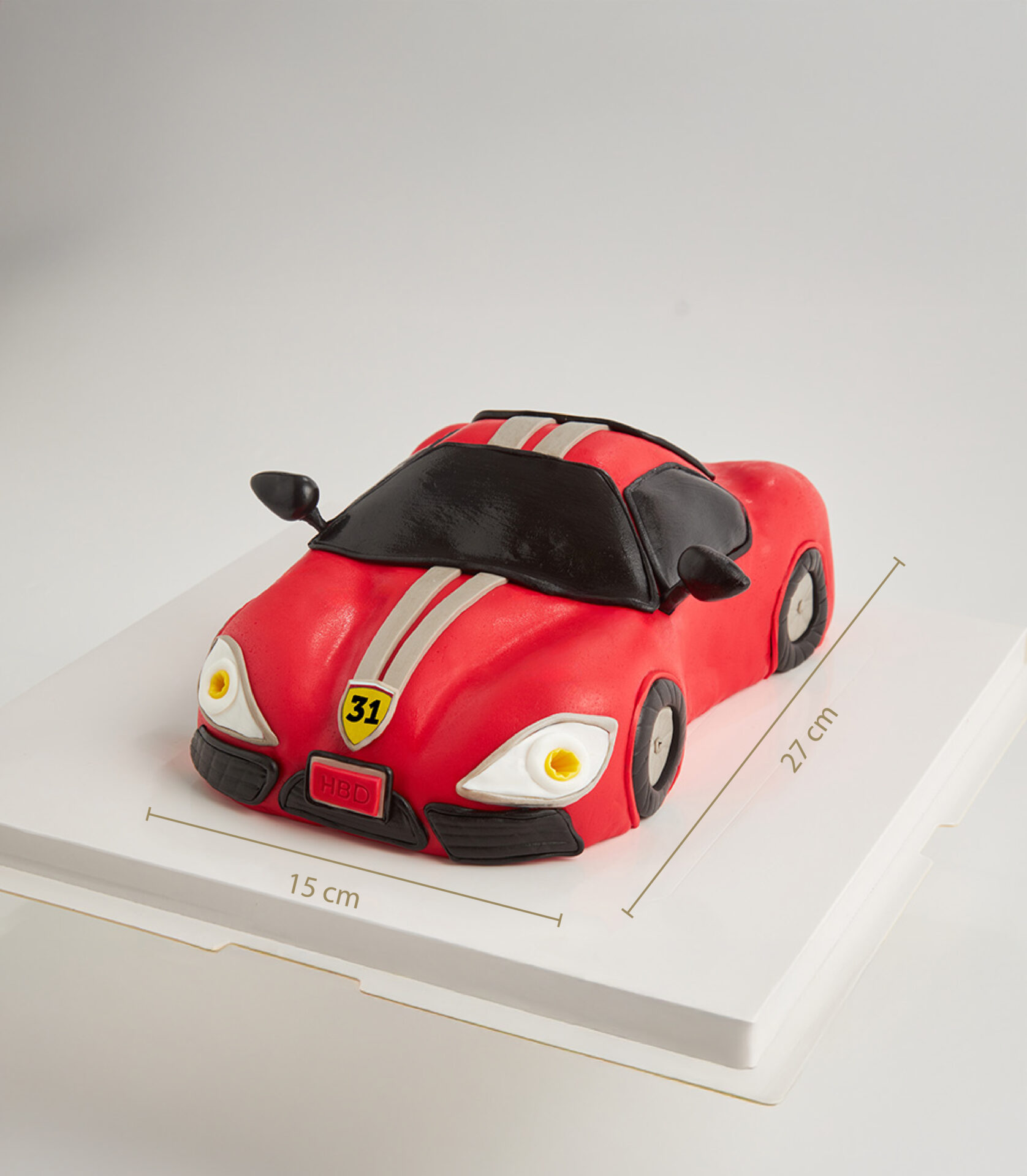 3D Ferrari-style red birthday cake with number 31 badge and HBD plate, size 15x27 cm.