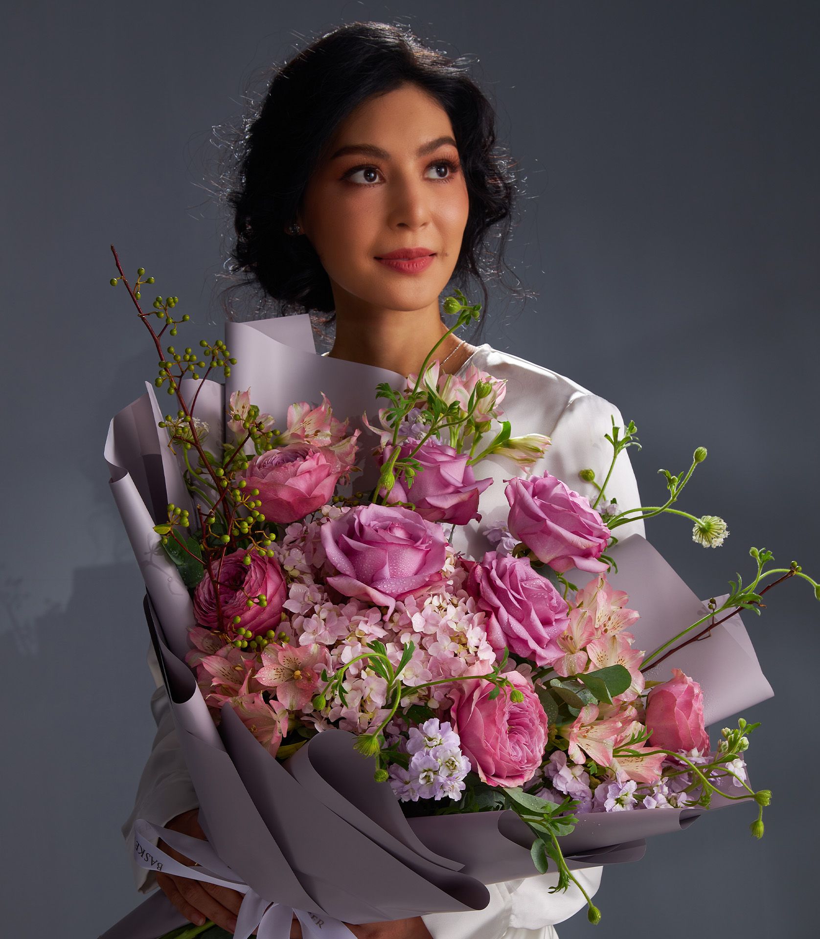 Elegant bouquet featuring Cool Water roses, Peonikiss roses, pink hydrangeas, pink alstroemeria, purple stock, and green berries.