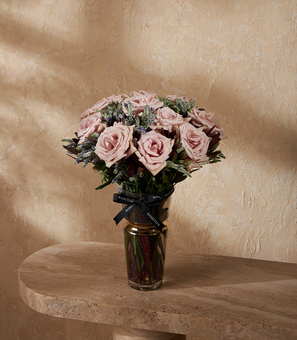Elegant vase with mauve roses and delicate fillers arranged in a chic style. A premium floral gift perfect for Bangkok delivery.