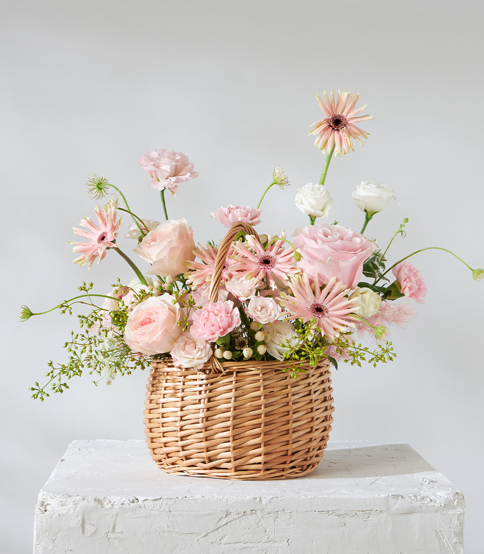 Flower arrangement basket with pink roses gerberas carnations and lisianthus for premium delivery in Bangkok
