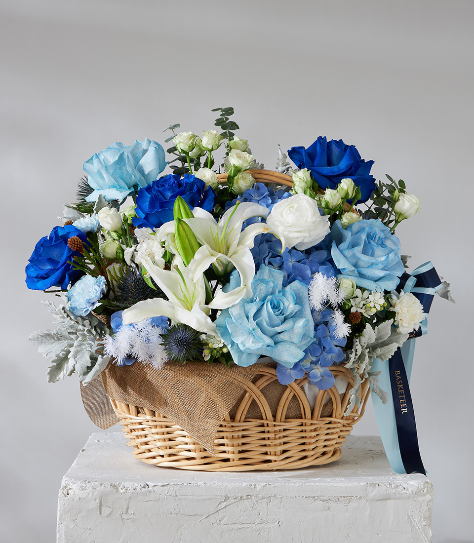 Flower arrangement basket with blue roses white lilies and hydrangeas for premium delivery in Bangkok