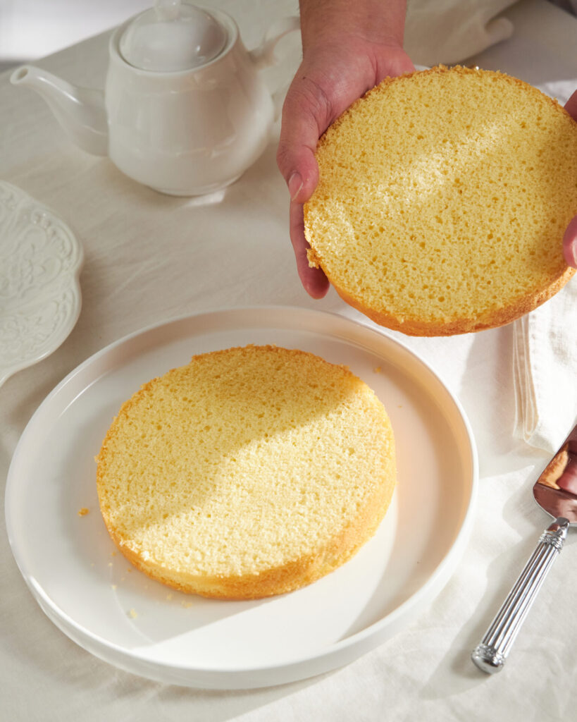 Two sponge cake layers prepared for filling at Charlotte Bakery Bangkok