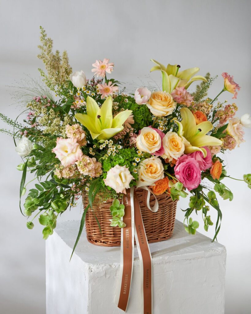 Yellow and peach flower basket from Flowers by Basketeer