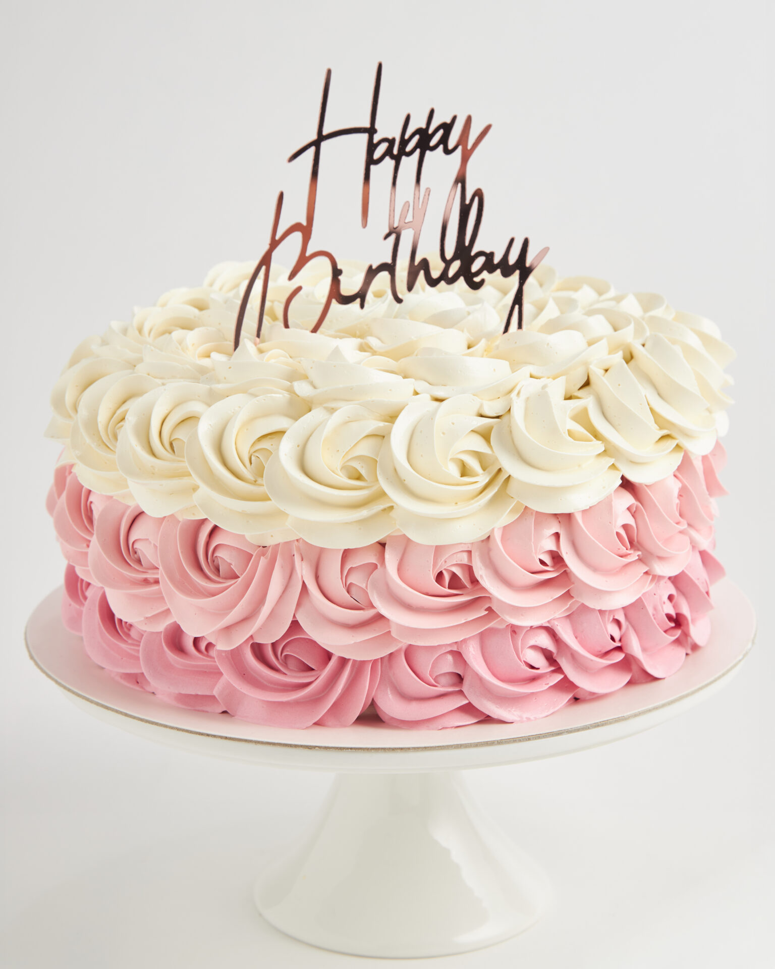 Pink ombre rosette birthday cake handcrafted by Charlotte Bakery Bangkok