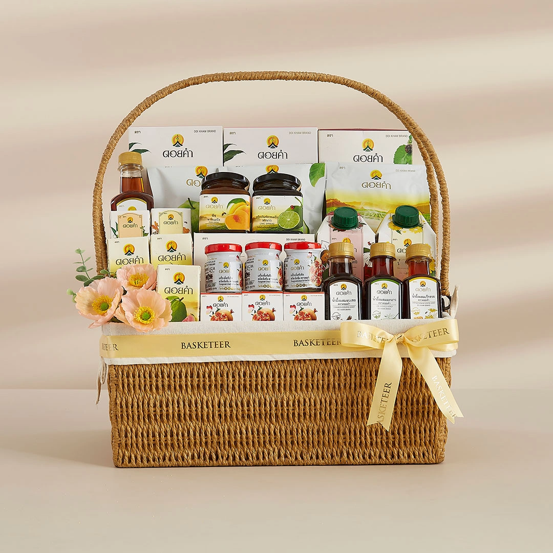 Doi Kham gift basket filled with natural Thai wellness products, beautifully arranged in a premium wicker basket with gold Basketeer ribbon