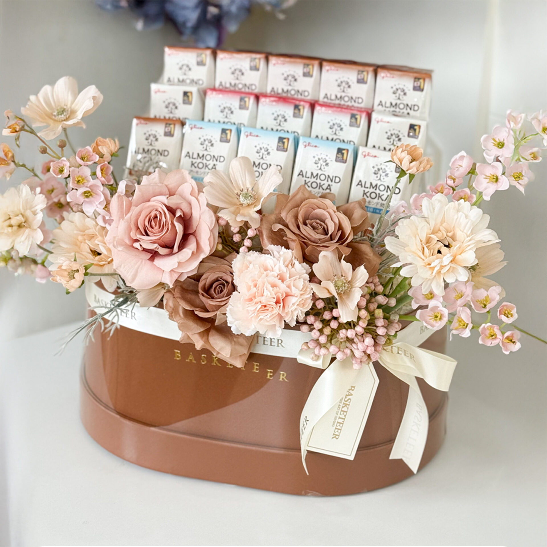 Luxury pastel rose gift basket with almond chocolates by Basketeer Thailand