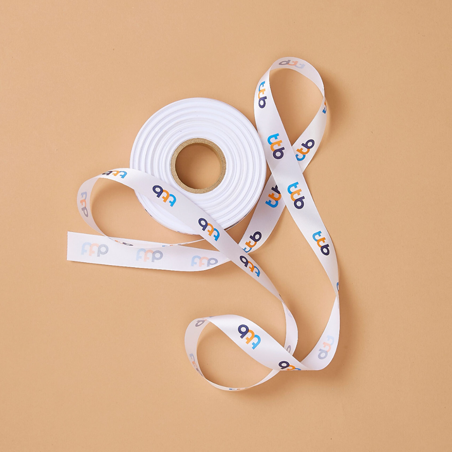 Custom logo printed ribbon roll for corporate gift branding by Basketeer Thailand