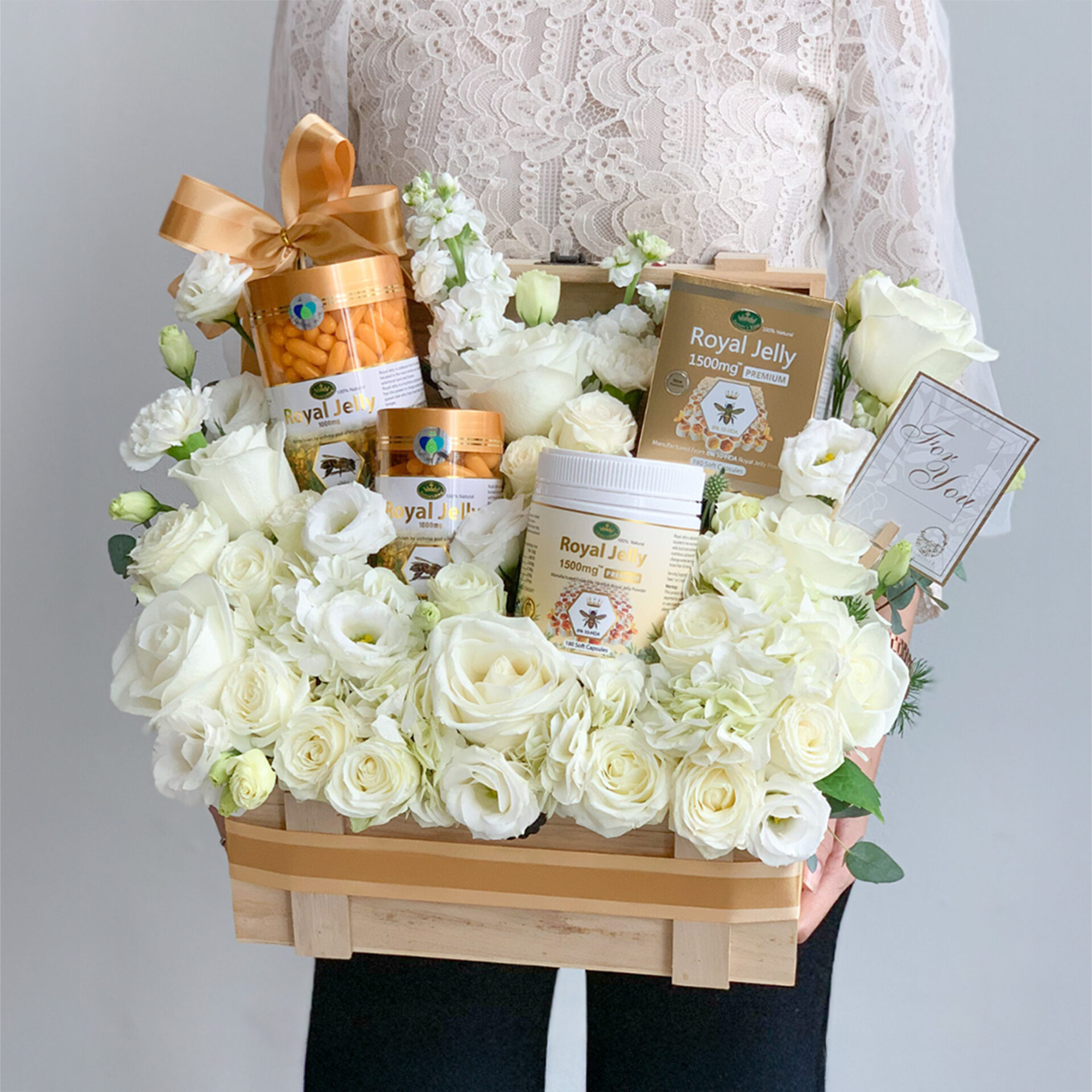 White rose wellness gift basket designed by Basketeer Thailand with royal jelly and health products