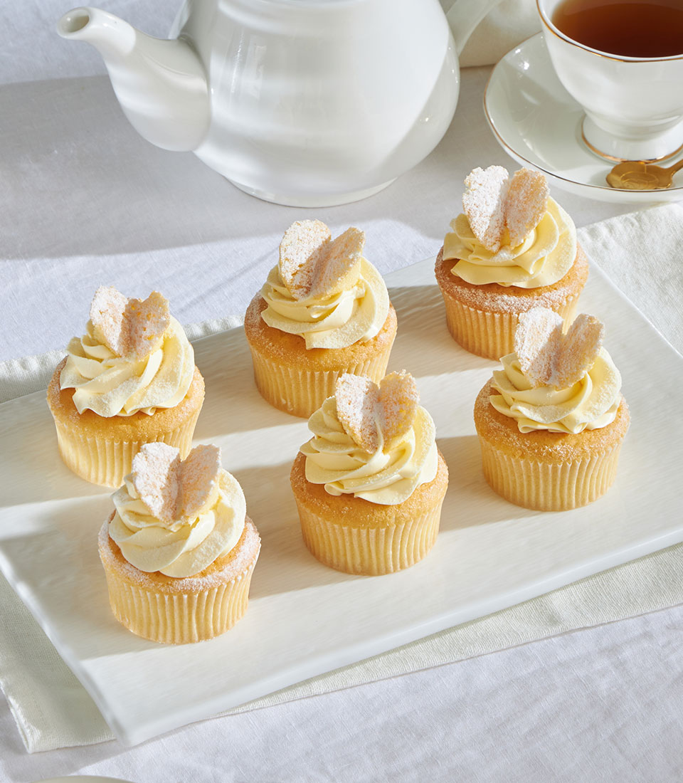 Butterfly-topped sponge cupcakes with whipped cream frosting – Charlotte Bakery Bangkok delivery