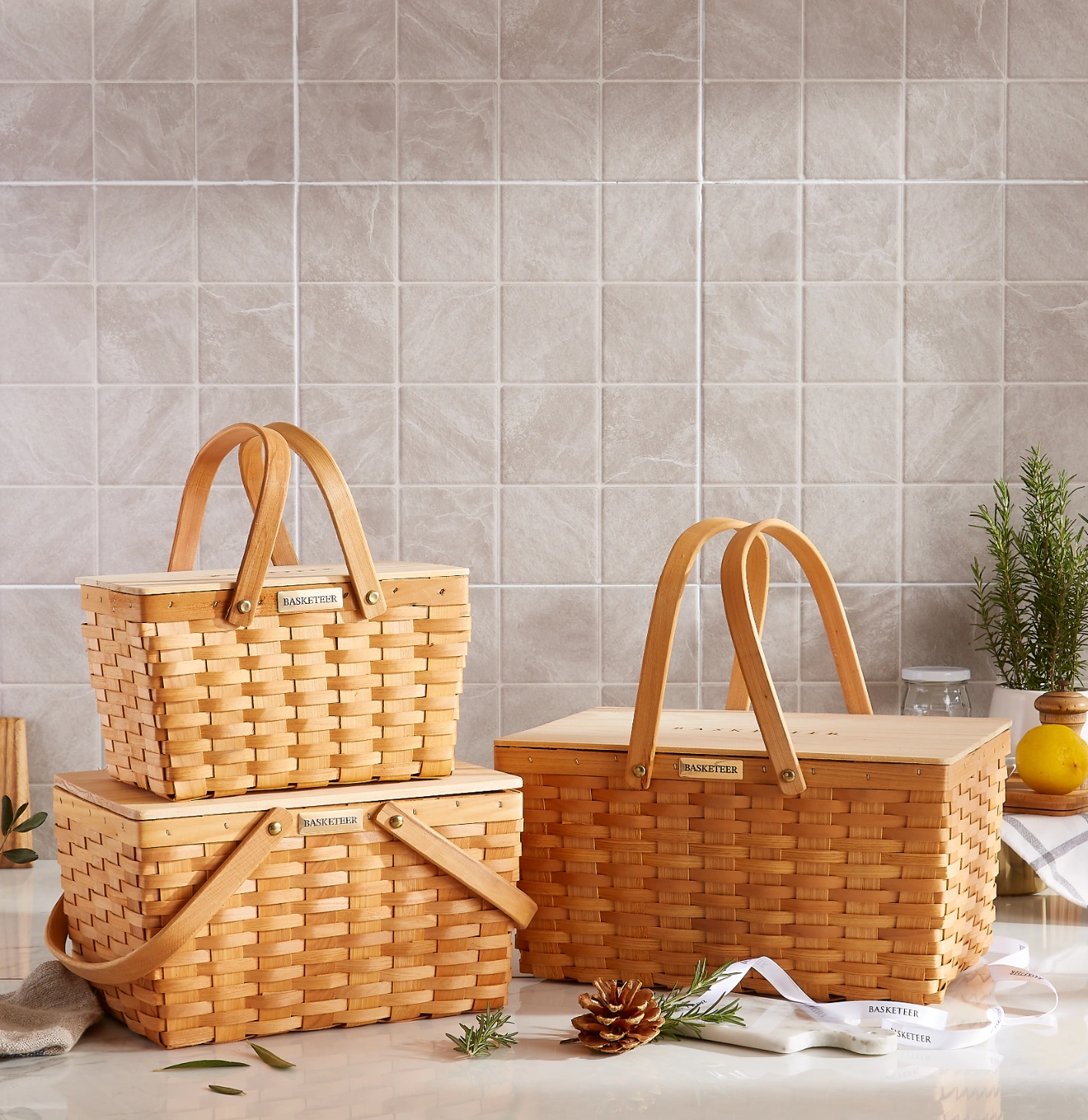 Basketeer in-house delivery team holding a premium gift basket, wearing Basketeer uniforms, ensuring safe and professional delivery in Bangkok