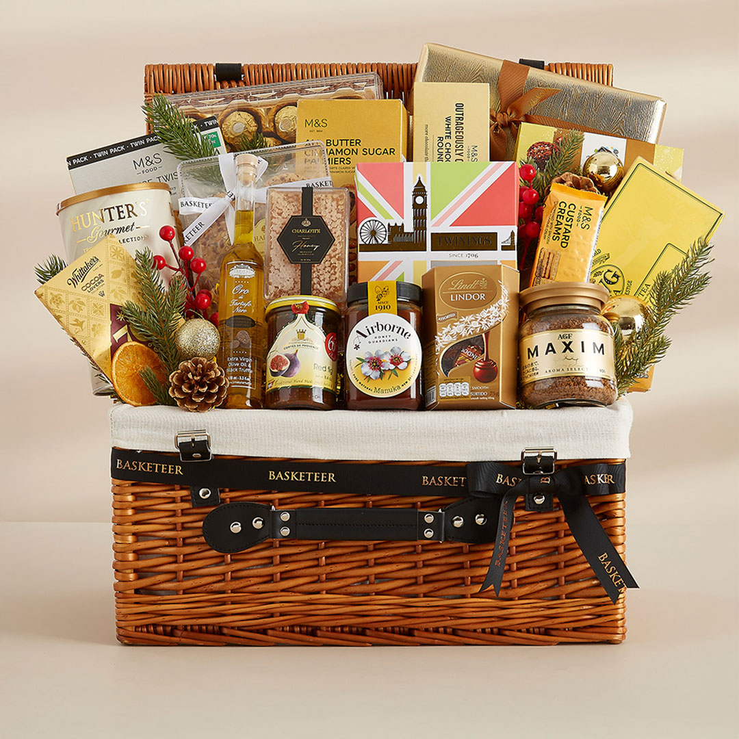 Luxury New Year gift basket with premium chocolates, tea, and festive packaging — elegantly designed by Basketeer Thailand.