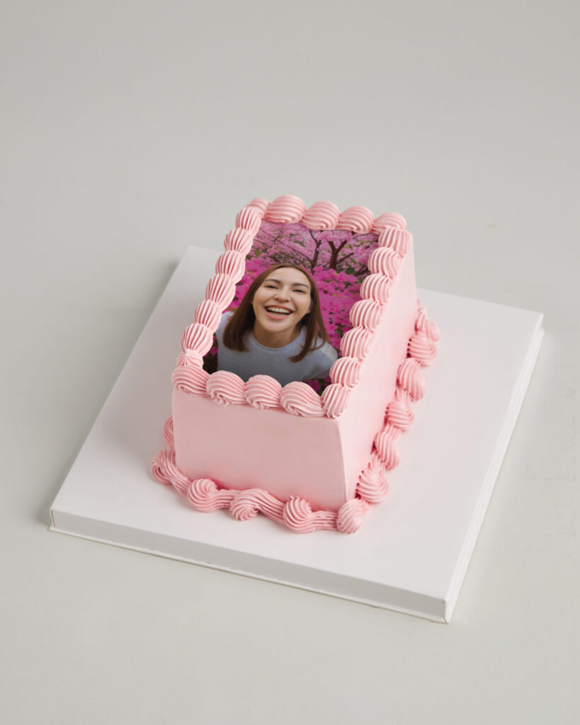 Charlotte Bakery Bangkok’s rectangular pink cake with piped icing and a printed photo, crafted for memorable celebrations.