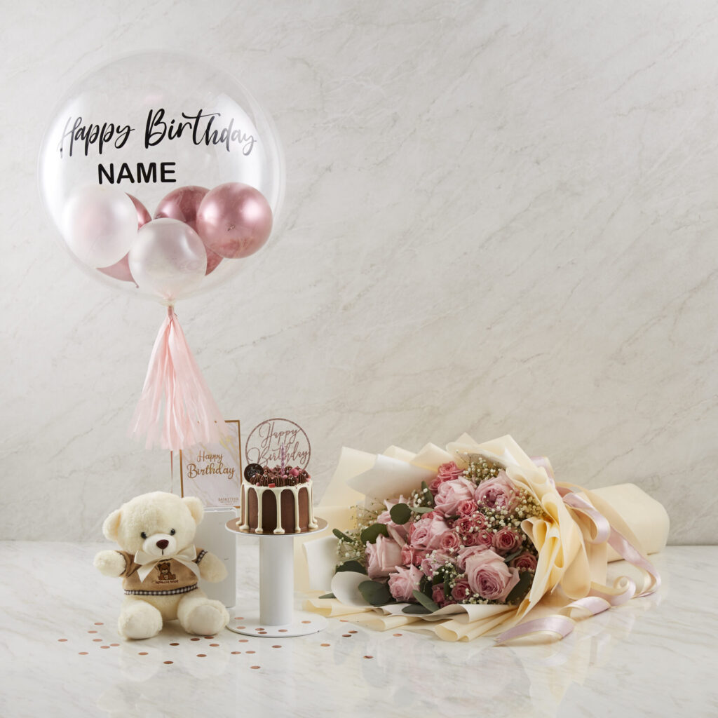 Celebrate in style with Charlotte Bakery’s decadent chocolate cake, elegant pink rose bouquet, luxurious teddy, and bespoke balloon.